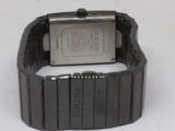 a close up of a wrist watch on a white surface