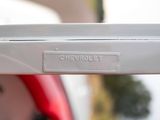 a close up view of the back end of a red car