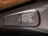 a close up of a car ' s emblem on the door handle