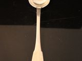 a spoon that is sitting on top of a table