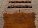 a wooden box that has a bunch of wine bottles in it