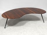 a close up of a coffee table with a wooden top