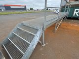 a ramp on the side of the road next to a truck