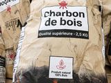 several bags of charcoal are stacked on top of each other