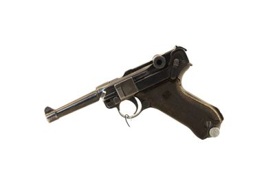un pistolet sur fond blanc, avec une découpe au niveau de la gâchette