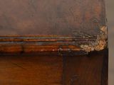 a close up of a piece of wood with peeling paint on it