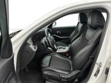 the interior of a white car with black leather seats and a steering wheel