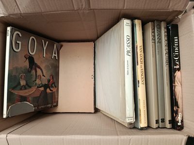 a box full of books sitting on top of a table