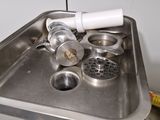 a sink that has a bunch of items in it