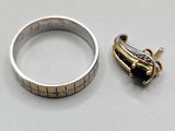 un gros plan sur une bague en argent, une bague en or et une bague en diamant