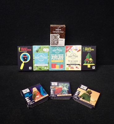 a lot of books that are on a black table