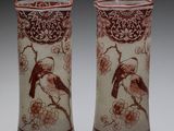 pair of chinese vases with birds and flowers on them