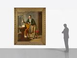 a man that is standing in front of a painting