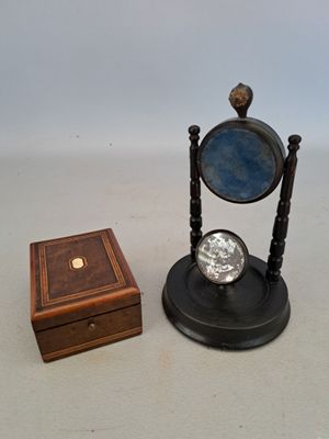 a small wooden box with a mirror on top of it