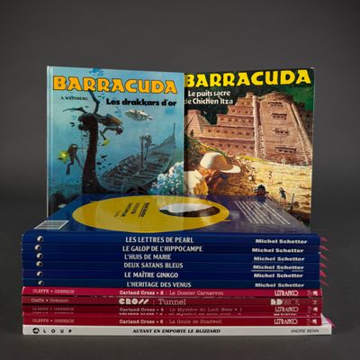 several books are stacked on top of each other on a table