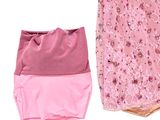 a pink dress and a pink bag sitting next to each other