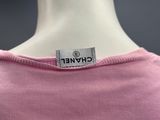 a close up of a pink shirt with a label on it