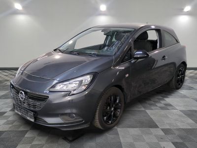 a picture of a grey car parked in a garage