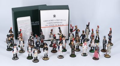 many figurines of different sizes and colors in a box