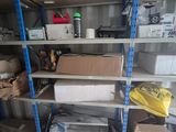 a shelf with many items on it in a garage