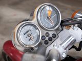 a close up of a motorcycle with a speedometer and gauges on it