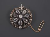 an antique diamond and gold broochle