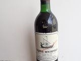 a bottle of wine that is sitting on a table