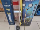 two boxes of electronic equipment sitting on a tiled floor