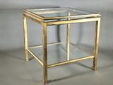 gold metal and glass side table with a glass top