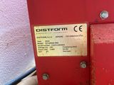 a red machine that is sitting on a wooden table