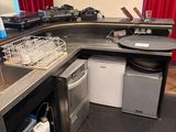 a kitchen with a sink, dishwasher, and dishwasher in it