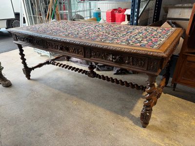 a wooden table with a floral design on it