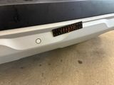 a close up of the bumper of a car with a sticker on it