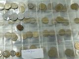 a lot of coins that are in a plastic bag