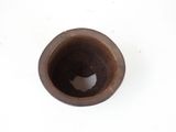an image of a brown cup on a white surface