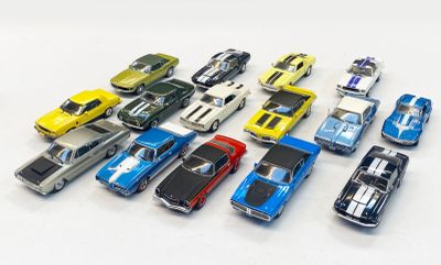 a lot of toy cars that are on a white surface