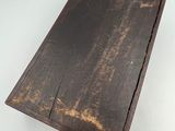 an old wooden box that is sitting on a table