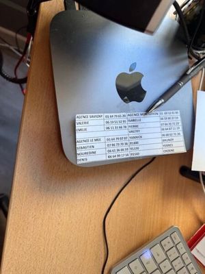 a keyboard and a mouse on a desk next to an apple computer