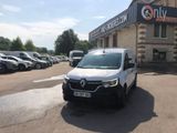 a white van that is parked in front of a building