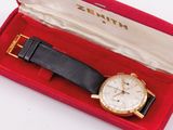 a watch in a red box on a white surface