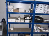 a room with a lot of boxes on the shelves