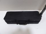 a black case with a pen in it sitting on a table