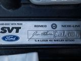 a close up of a car ' s name plate on a vehicle