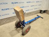 a small cart with a wooden block attached to it