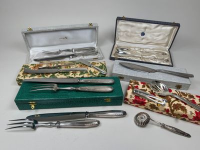 many different types of silverware in a case
