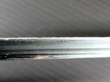 a close up of a knife that is on a table