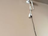 a camera mounted on the wall above a mirror