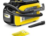 un nettoyeur à vapeur jaune et noir, avec un tuyau noir à côté
