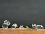 a lot of figurines that are sitting on a table