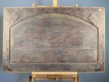a wooden easel with a painting on top of it